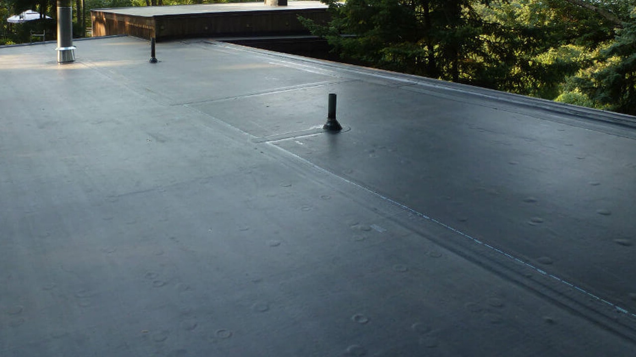 A beautiful, high-quality black roof by SkyLuxe Construction, expertly crafted for a residential property in Suffolk County, NY